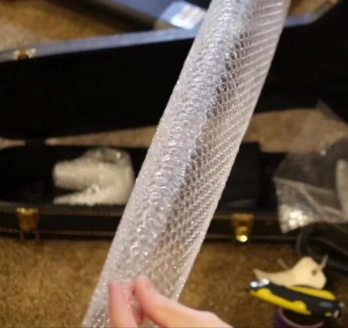 Create a second neck rest using folded bubble wrap for enhanced headstock protection.
