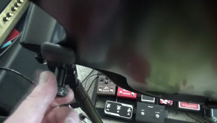 Carefully remove the collapsed spring and any associated washers, ensuring not to lose any small parts.