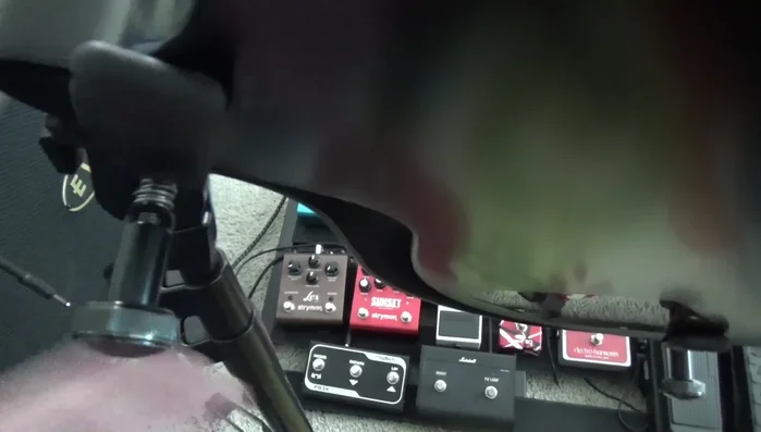 Identify the problem: A collapsed spring in the guitar clamp prevents secure clamping.