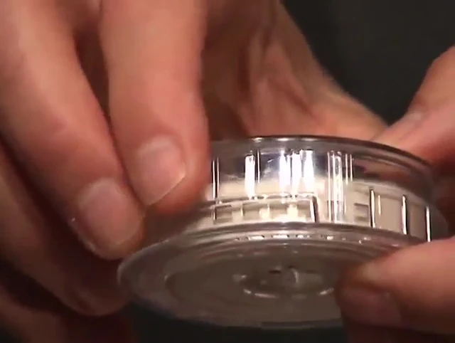 The rotating sleeve showing open and closed vents.