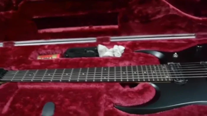 Explain the impact of weather changes (humidity) on wooden instruments and how hard cases help mitigate these effects.