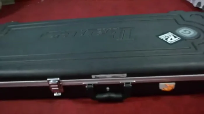 Explain the impact of weather changes (humidity) on wooden instruments and how hard cases help mitigate these effects.