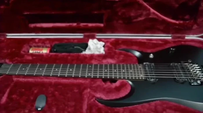 Explain the impact of weather changes (humidity) on wooden instruments and how hard cases help mitigate these effects.