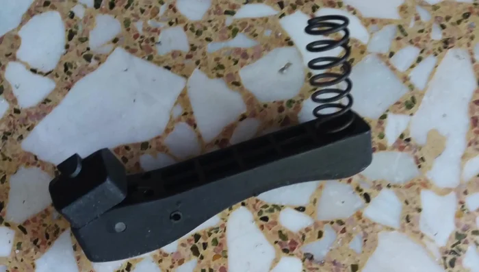 Search online for existing solutions or 3D printable models. While a simple nut and bolt fix exists, a more durable solution using a 3D printed replacement is the preferred method.