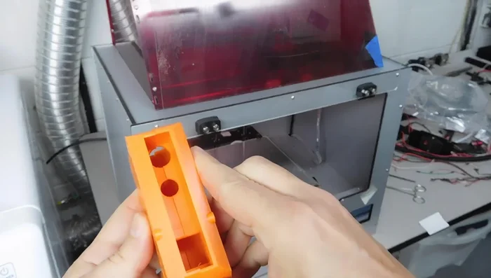 Install the handle onto the guitar stand, ensuring proper alignment using the index notches. The design features that accommodate the stand's mechanism for smooth movement and locking.