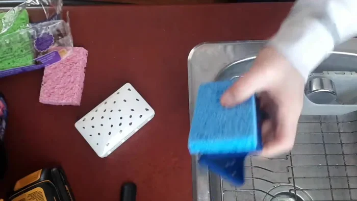 Let excess water drip out until it mostly stops dripping. Avoid over-saturation to prevent leaks in the case.