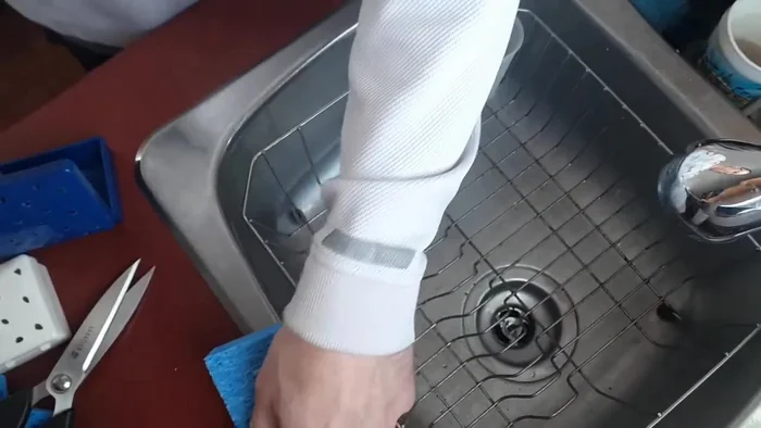 Let excess water drip out until it mostly stops dripping. Avoid over-saturation to prevent leaks in the case.