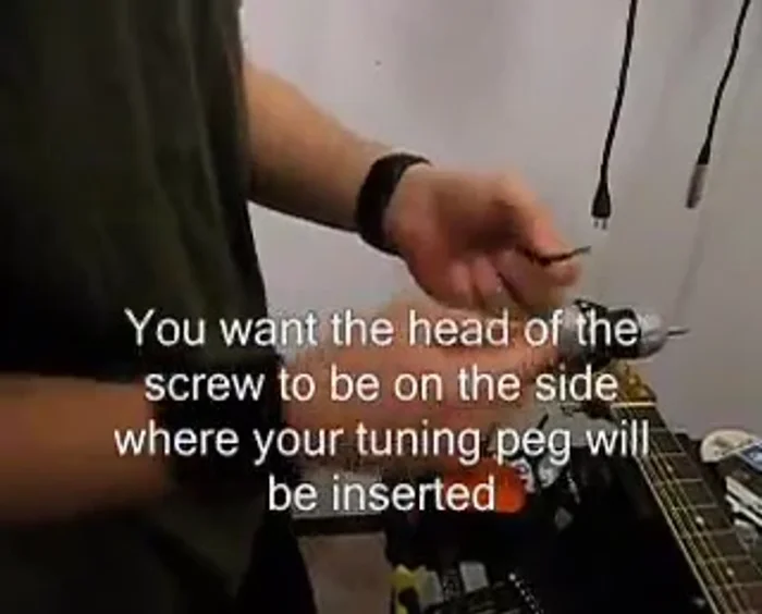 Tighten the nut using pliers, ensuring it's secure.