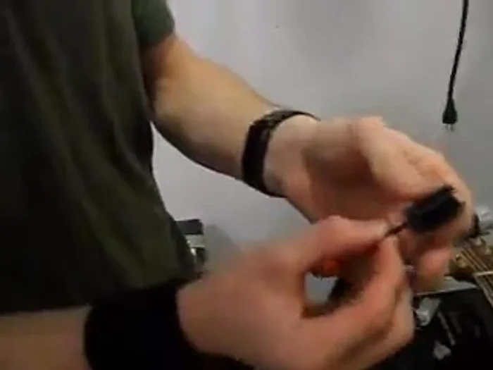 To wind the string, turn the drill to the *right* (opposite of a typical screw). Be careful not to overtighten and break the string.