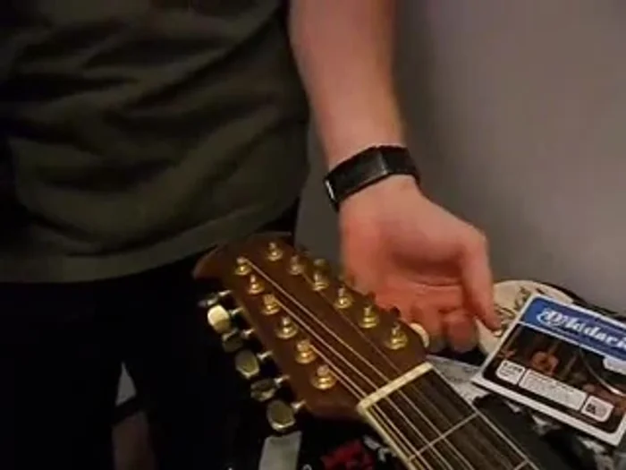 To wind the string, turn the drill to the *right* (opposite of a typical screw). Be careful not to overtighten and break the string.