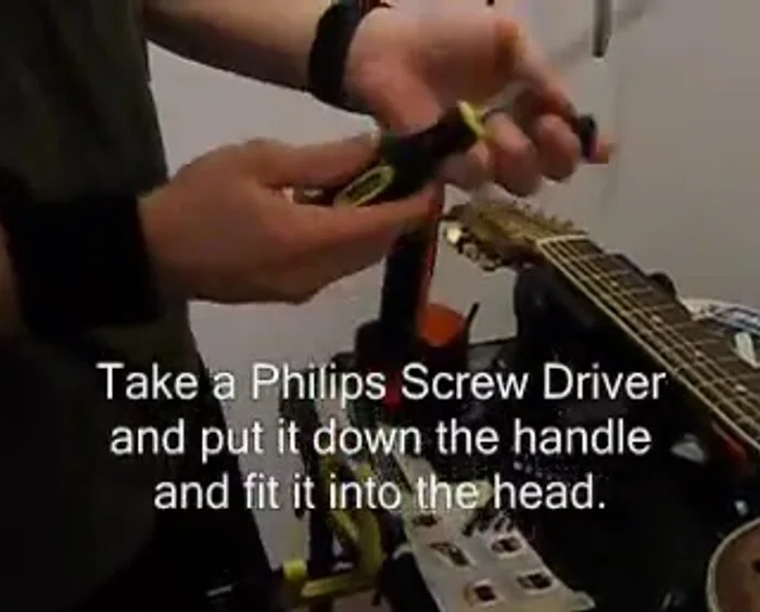 Remove the internal mechanism from the tuner casing. The screw will be on the handle.