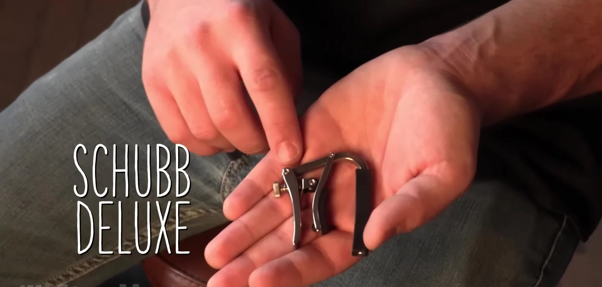 Example of an adjustable tension capo