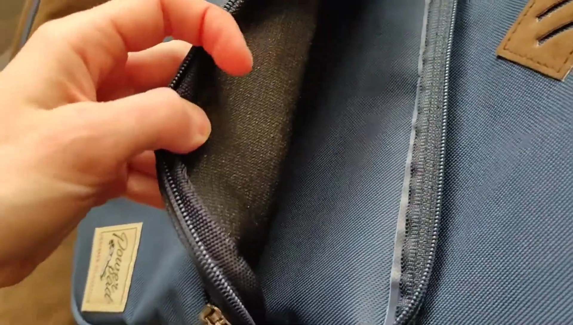 Second pocket showing limited zipper opening