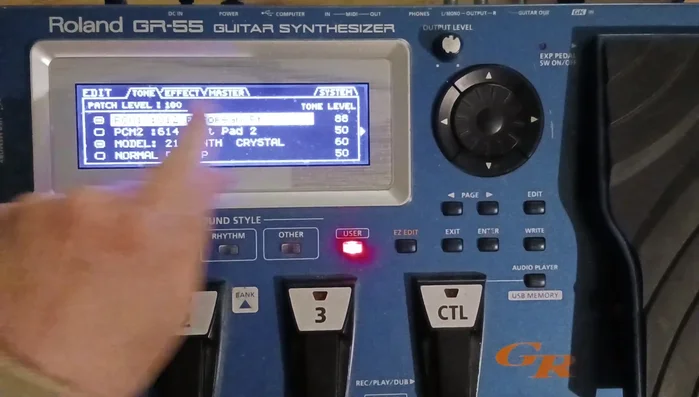 Navigate to GK Settings: Use the page buttons (left/right arrows) to move to the 'System' page, then select 'GK settings'.