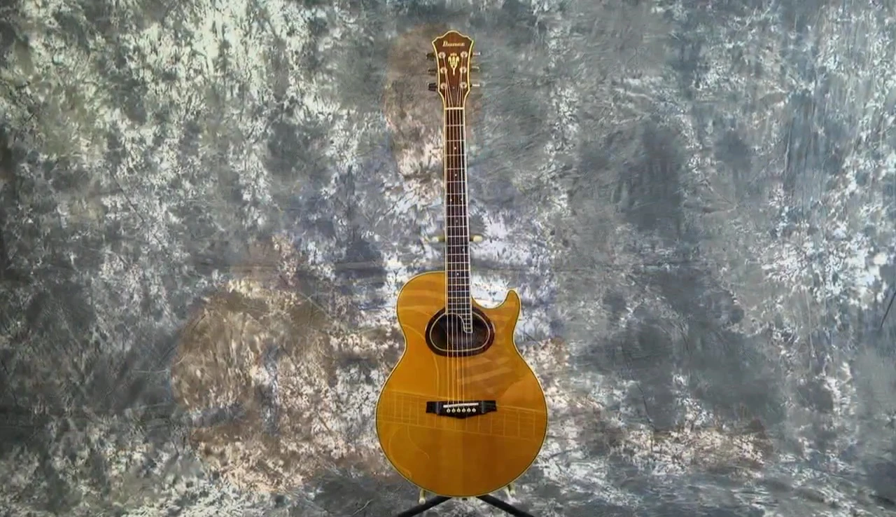 Close-up shot of the Ibanez R400 Ragtime headstock, showcasing the logo and model name.