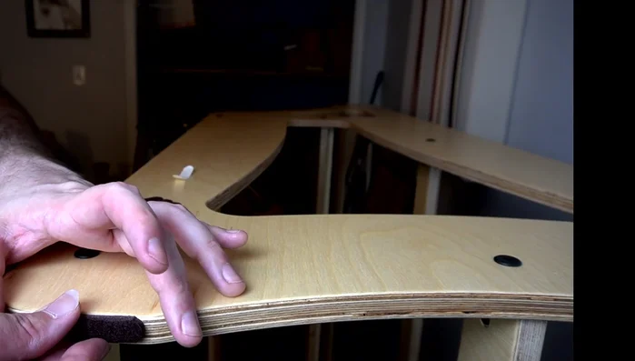 Apply the adhesive strips to the bottom of the rack to protect your floors.