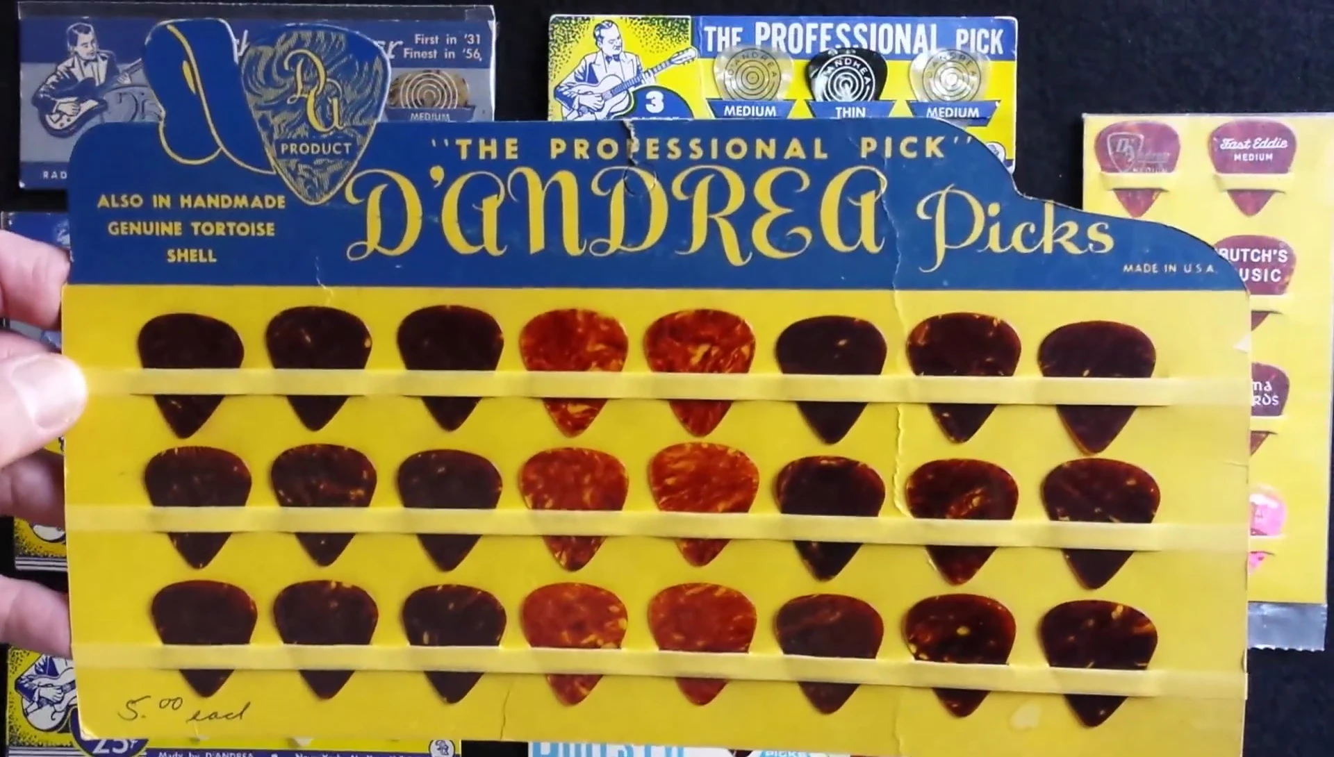 A close-up of a 1960s D'Andrea pick display