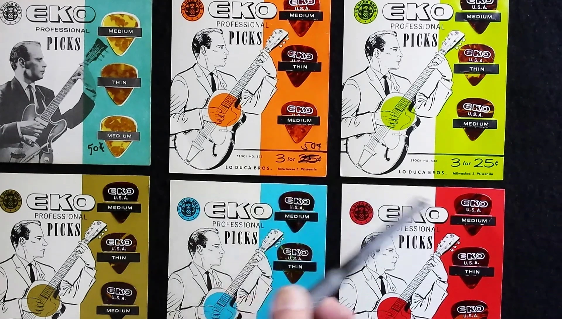 Close-up of the Laduka Brothers' distribution information on an Eko pick card