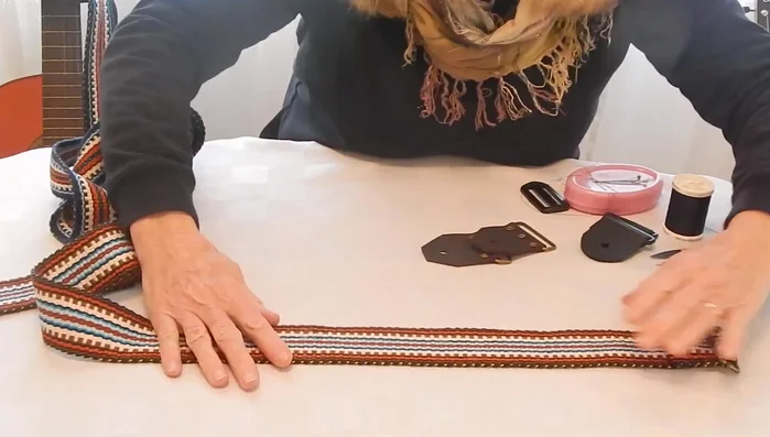 Attach the floater tab (non-fixed tab): Feed the strap through the ring, ensuring no twists.