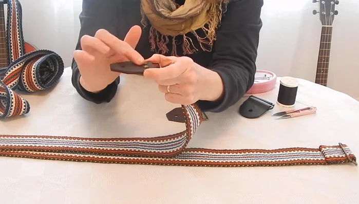 Attach the floater tab (non-fixed tab): Feed the strap through the ring, ensuring no twists.