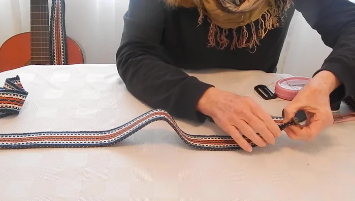 Hand-stitch the slider in place, underlapping the underside to prevent overlap on the front. (Optional: Top-stitch with a sewing machine afterwards).