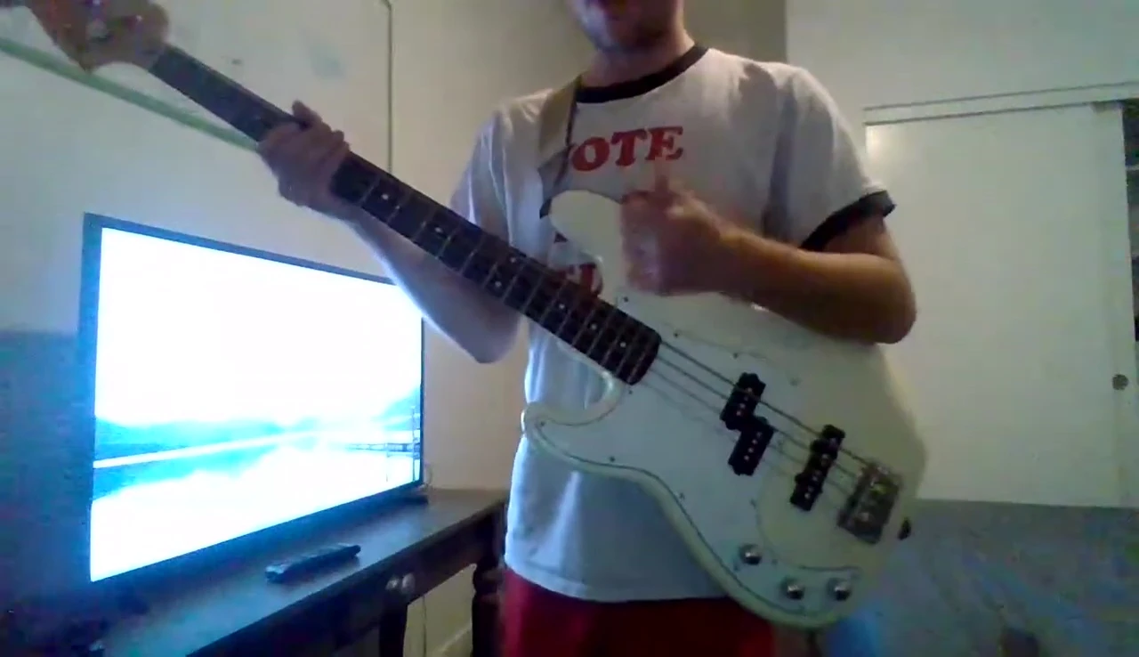The bassist demonstrating slapping technique