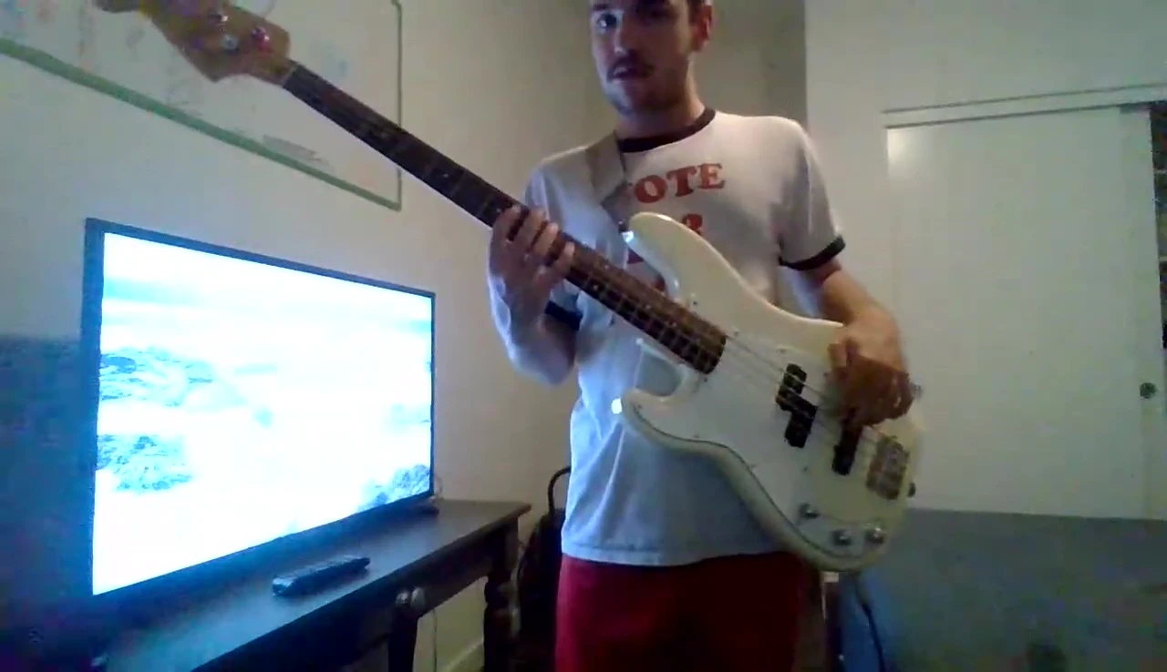 Final shot of the bassist with the bass