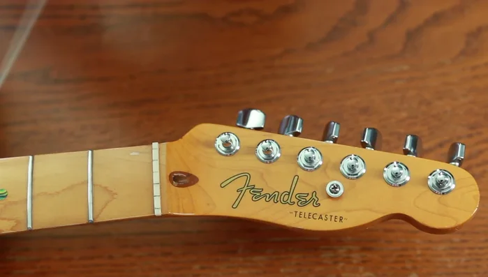 Bend string around post, tuck under, and pull tight.