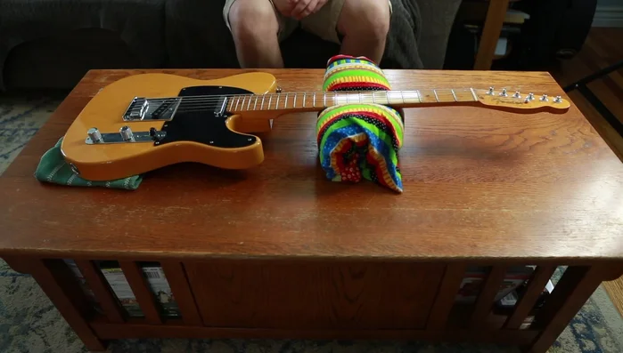 Remove old strings from tuning pegs.