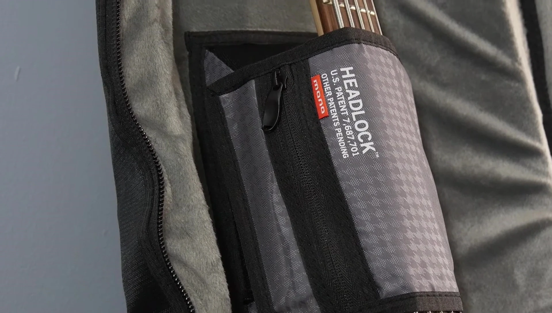 Close-up shot of the small internal pocket for picks and other small items.