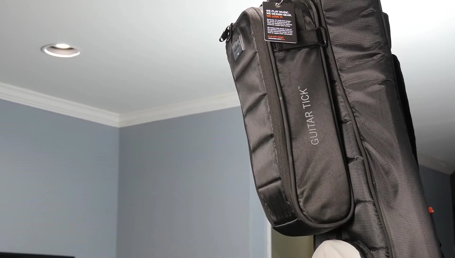 The Mono Guitar Tech attachment shown attached to the bass case.