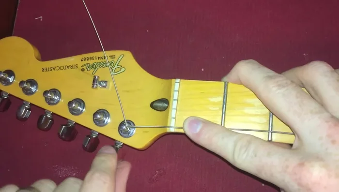 Repeat step 4 to create a small 'lock' that prevents the string from slipping.