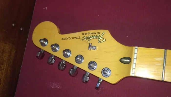 Pull each string up, leaving a small amount of slack (enough to create a small loop).