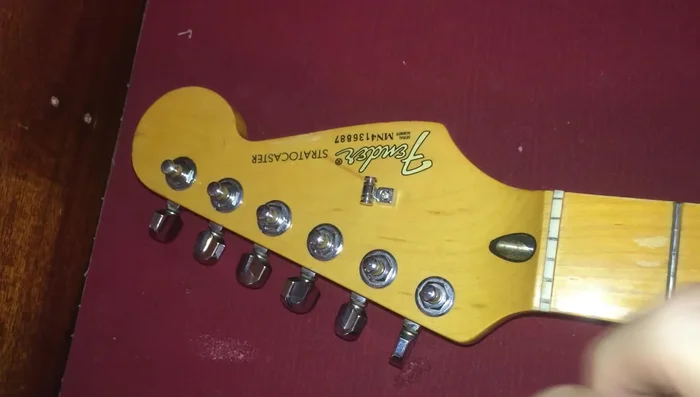 Pull each string up, leaving a small amount of slack (enough to create a small loop).