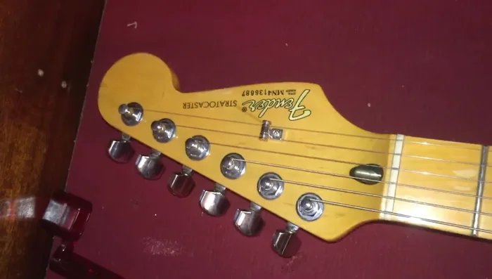 Tune your guitar and stretch the strings.