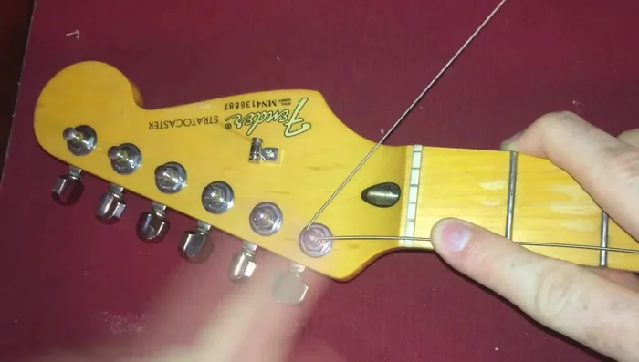 Repeat step 4 to create a small 'lock' that prevents the string from slipping.