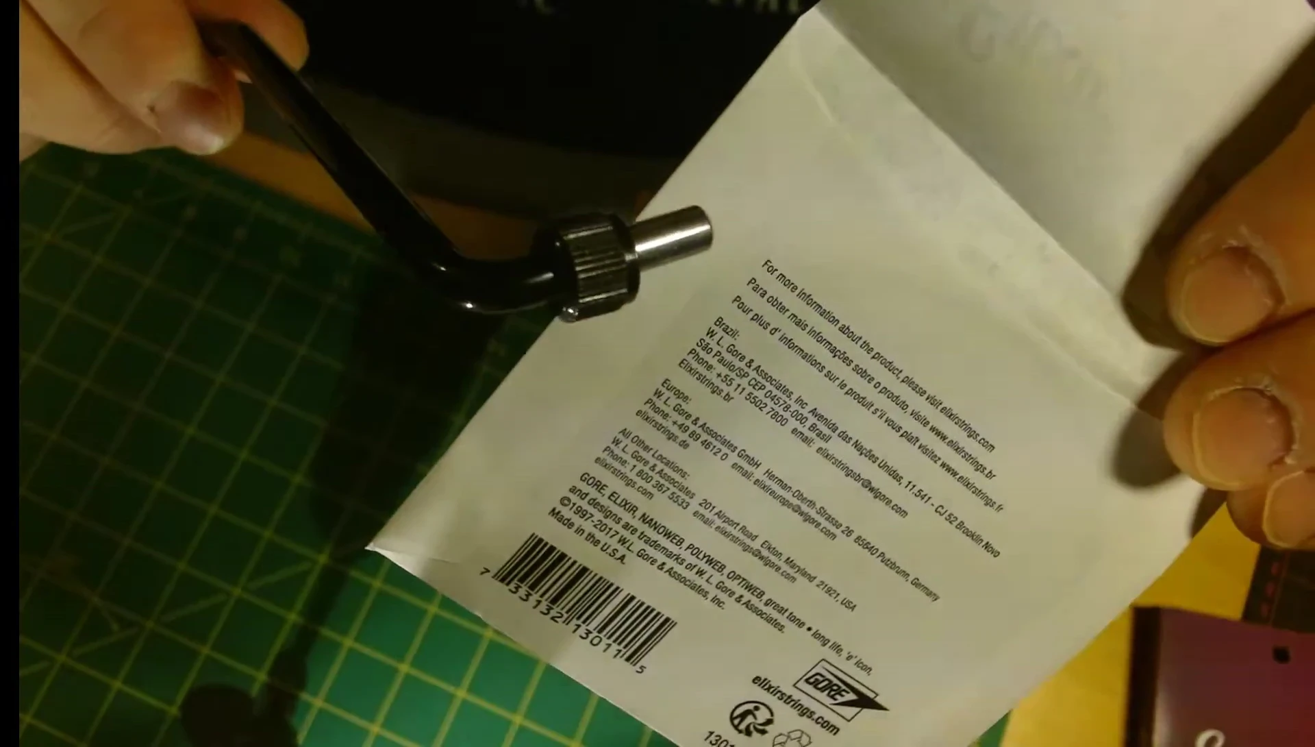 Close-up of neatly folded genuine Elixir string packaging.