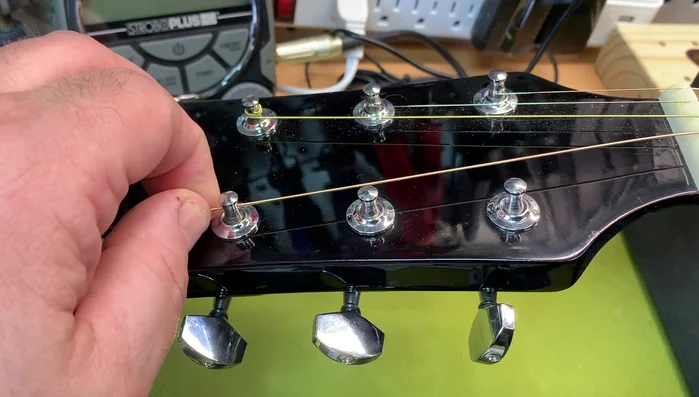 Measure the string (from first fret to second fret, or tuning peg to tuning peg).