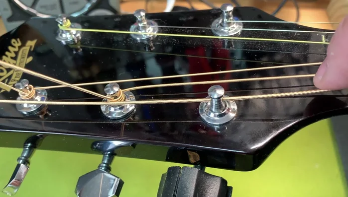 The first wrap goes over the string, and everything else goes under.