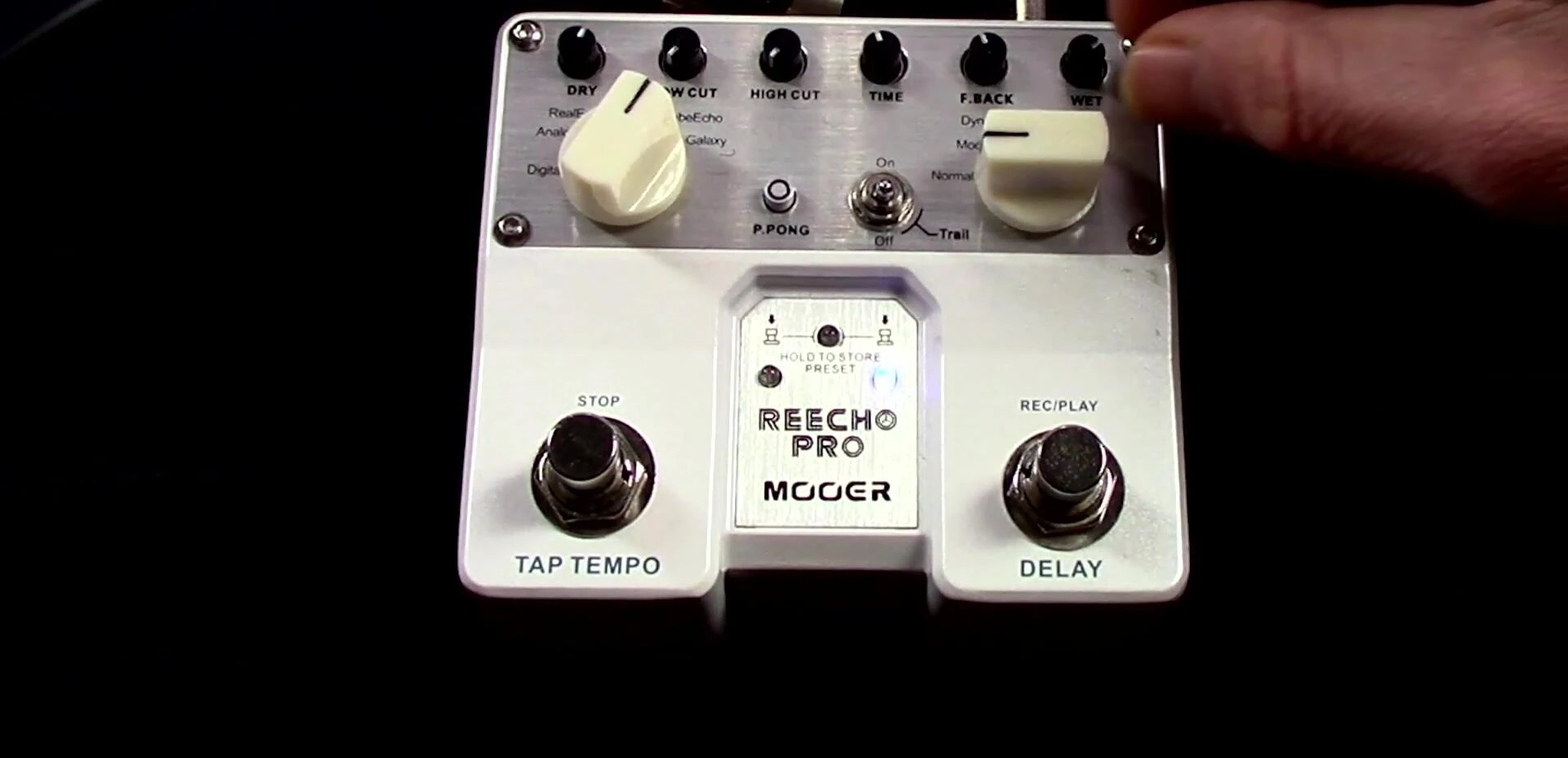 User effortlessly adjusting the controls during a performance