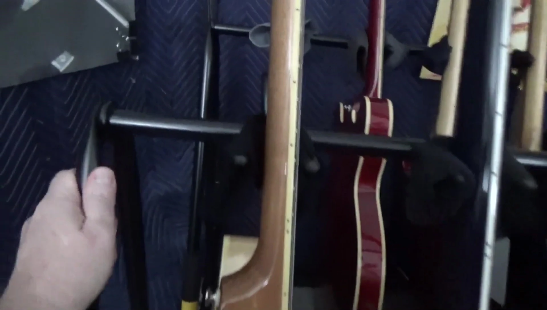 Overall shot showing the guitars securely in the rack.