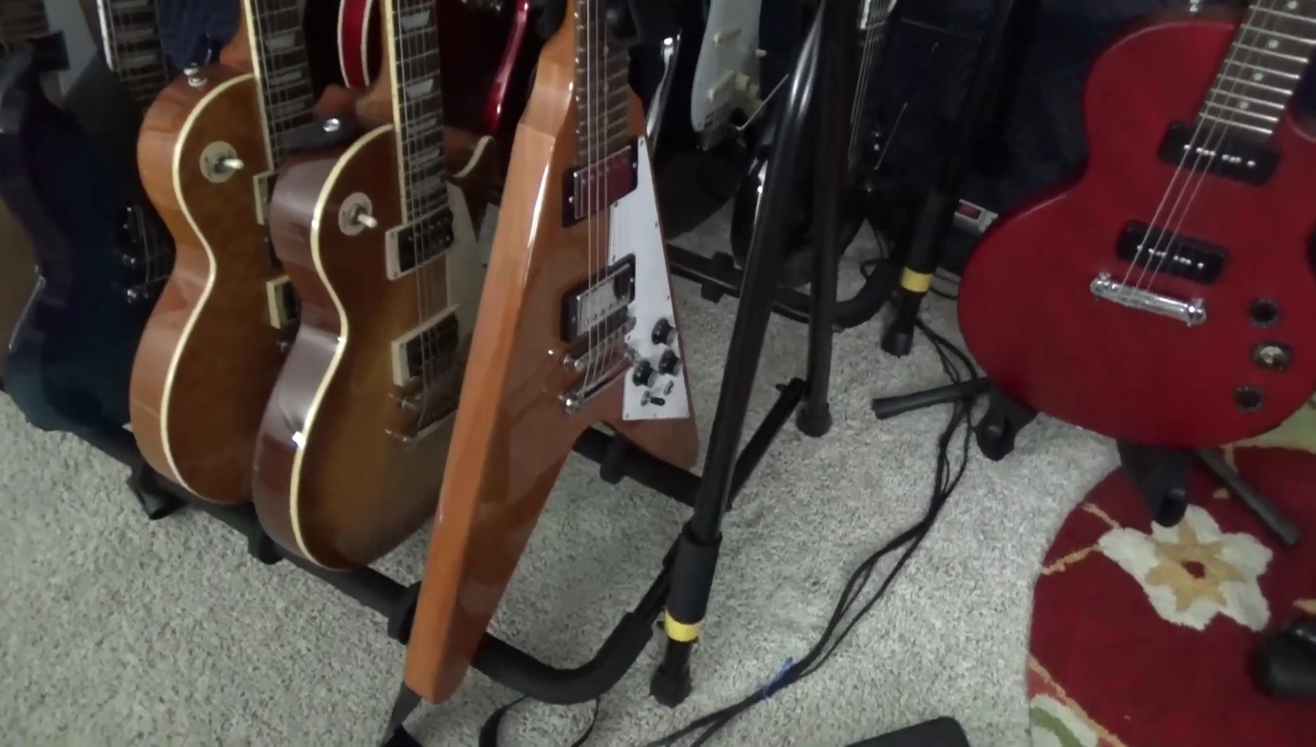 A Flying V guitar securely placed in the Hercules rack.