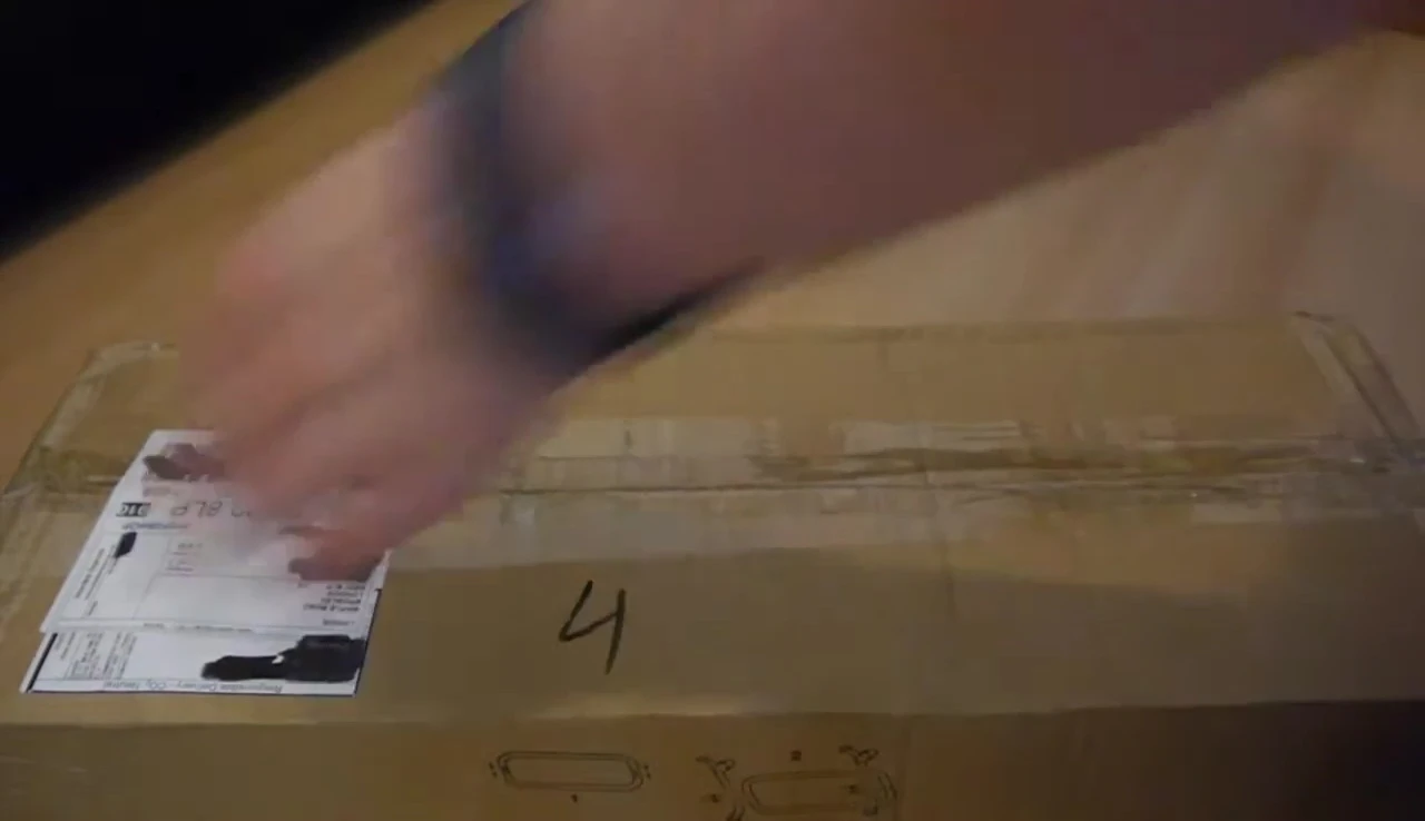 The triple guitar stand box being opened