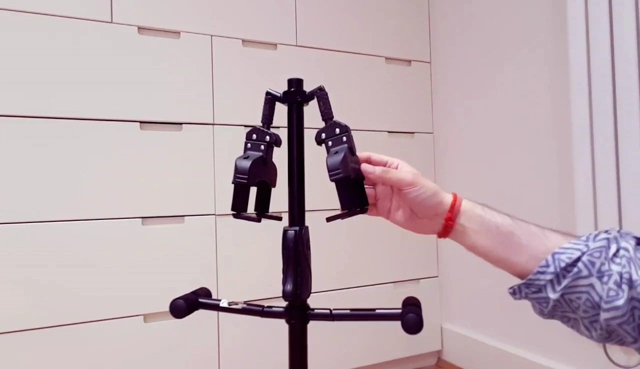 The wall-mount bracket shown, demonstrating its compatibility with the stand.