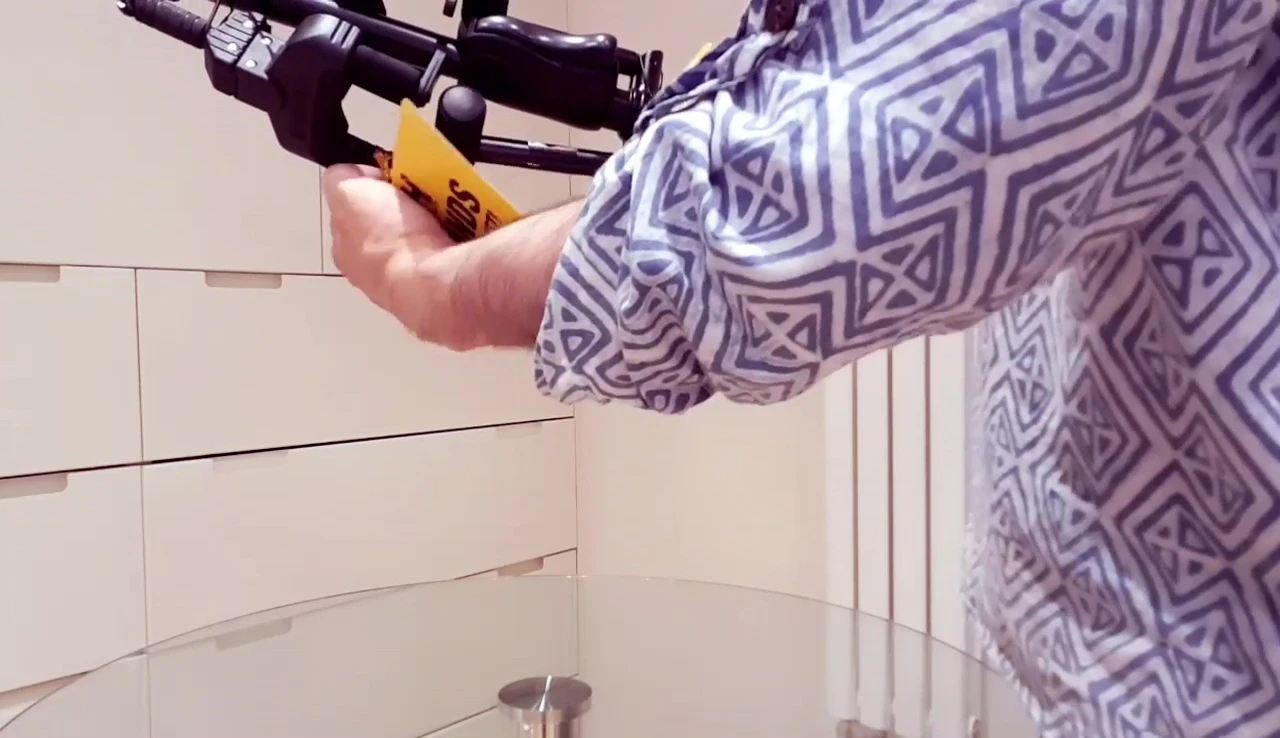 Unboxing the Hercules GS422B guitar stand, removing plastic ties.