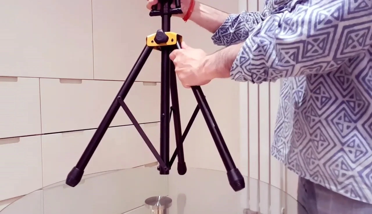 The fully extended base of the guitar stand, showcasing its stability.