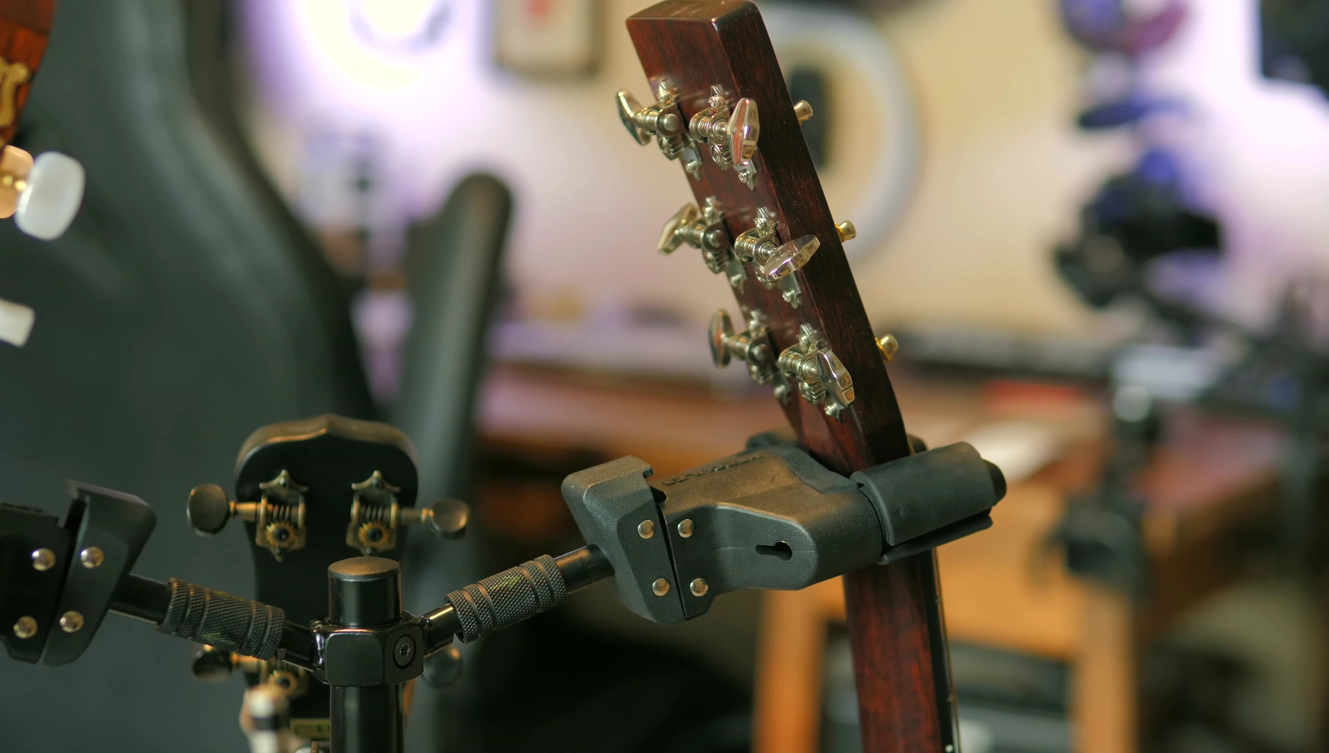 The holder with a violin and mandolin securely attached.