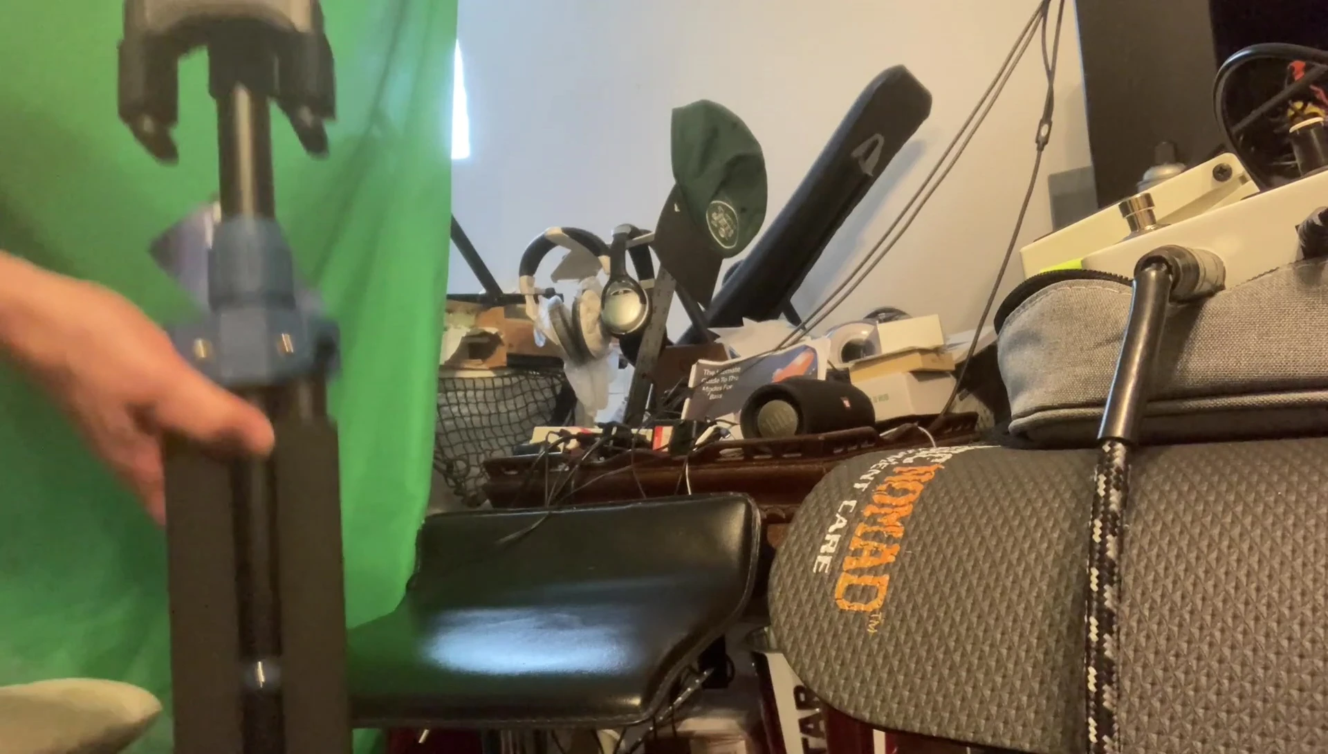 Overall shot of the stand with a guitar, emphasizing its professional appearance.