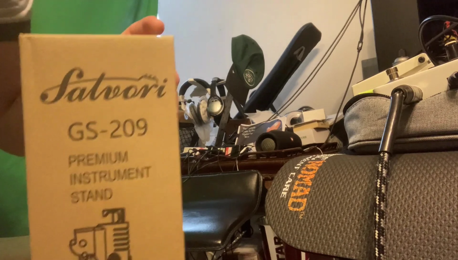 The gig bag hook located on top of the stand.