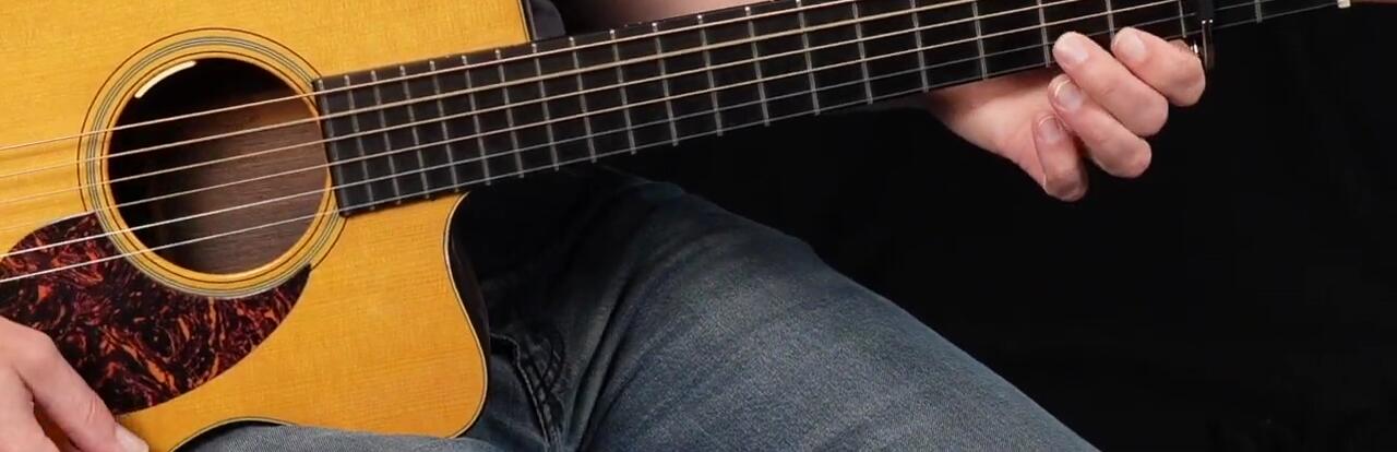 Guitarist using partial capos in combination with a standard capo
